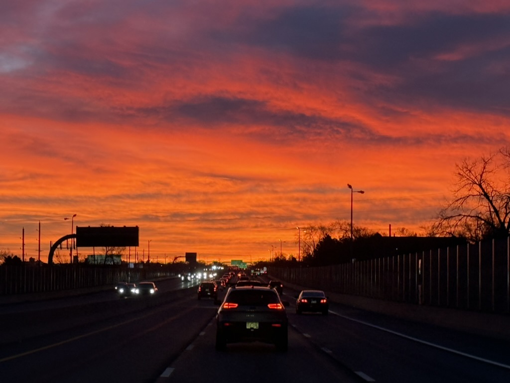 Bright red Colorado sunset over a highway