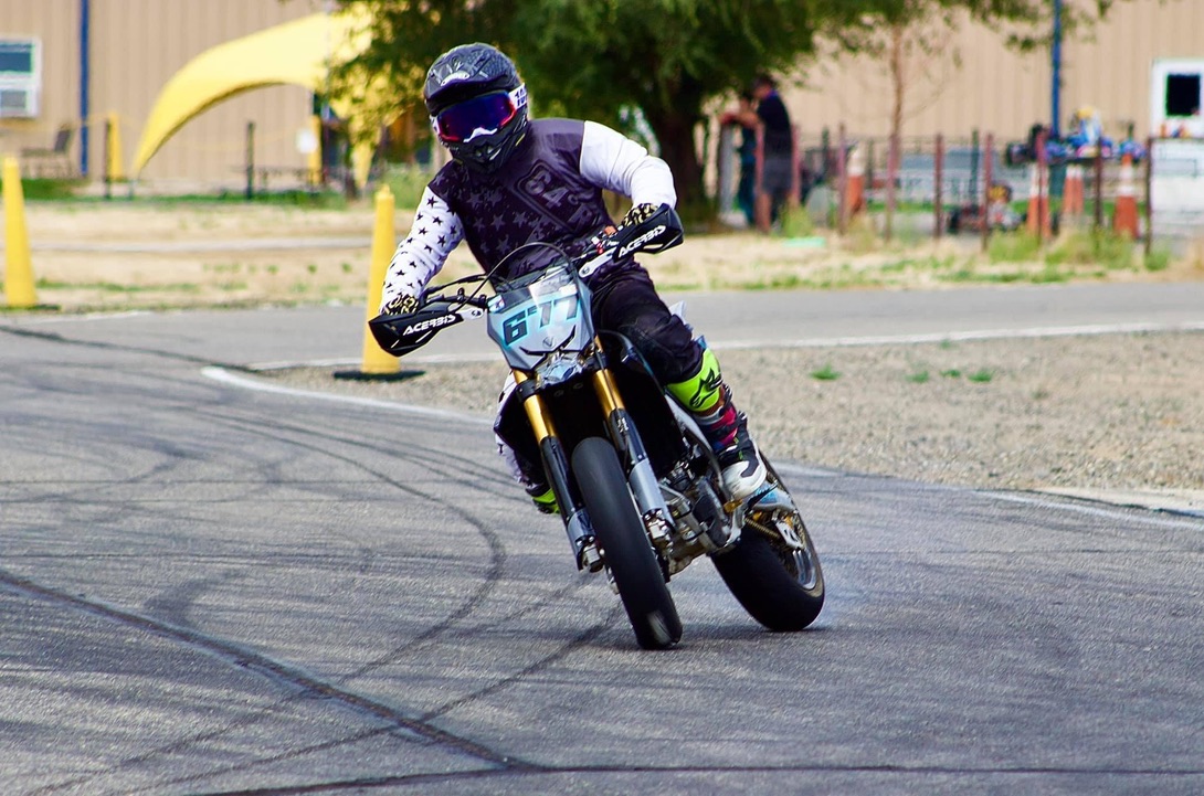 Supermoto rider leaning through a turn