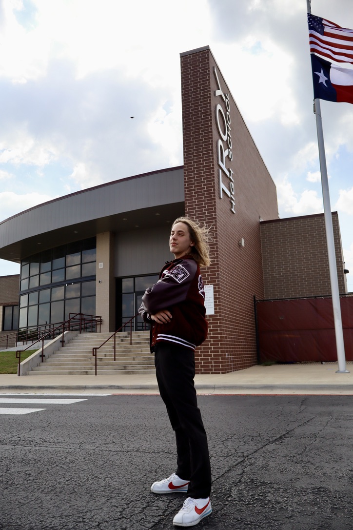 Senior portrait outside a school